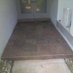 NEW RECTIFIED EDGE PORCELIN ENTRYWAY TILE WITH 1/8" GROUT LINES AFTER REMOVAL OF OLD TILE
