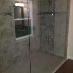 LARGE CUSTOM SHOWER WITH FAUCET VALVES ON BOTH ENDS. CUSTOM RECESS BOXES, WINDOW AND ZERO TRANSITION CURB.