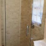 SMALL SPACES ARE PERFECT FOR NEO ANGLE STYLE STAND UP SHOWERS THIS ONE IS IN TRAVERTINE WITH BRUSHED NICKLE TRIM AND CUSTOM FRAMELESS GLASS