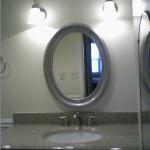 VANITY WITH GRANITE TOP , NEW FAUCET, MIRROR, AND TWO SCONCES