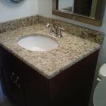 GRANITE COUNTER UPGRADE WITH CUSTOM 3/4" PLYWOOD CABINETS  AND MAPLE DOORS IN A BORDEAX FINISH.