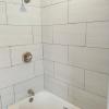 New steel enamel white tub 12x24 tile walls new valve and drain kit